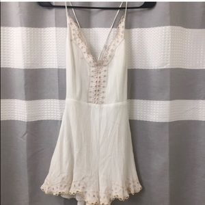 Lush white and tan trim romper